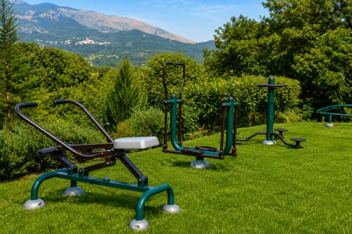 Outdoor fitness equipment in verdant garden with mountain views at Country House Bosco d'Olmi, Sant'Andrea del Garigliano