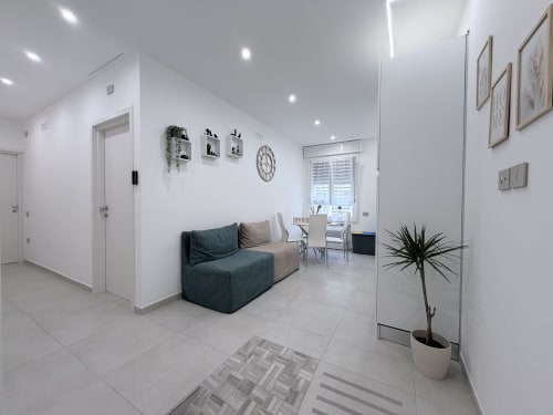 Suite Modern Dream Bologna con letto matrimoniale e divano letto, angolo cottura e vista sulla corte interna