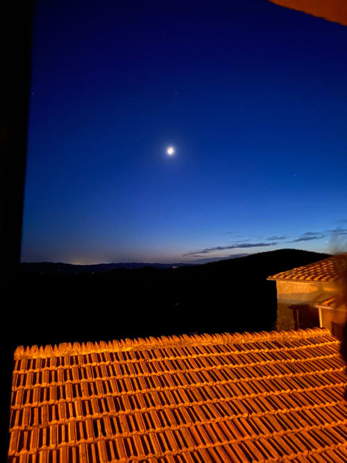 Moon and stars above Tuscan countryside from Bellavista Suite terracotta roof at Tuscan Townhouse, Montemassi