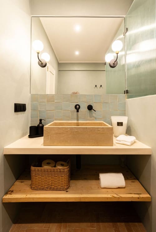 Modern bathroom with natural wood vessel sink and vessel faucet in Sea'Ya Casa Pavão villa, Colares