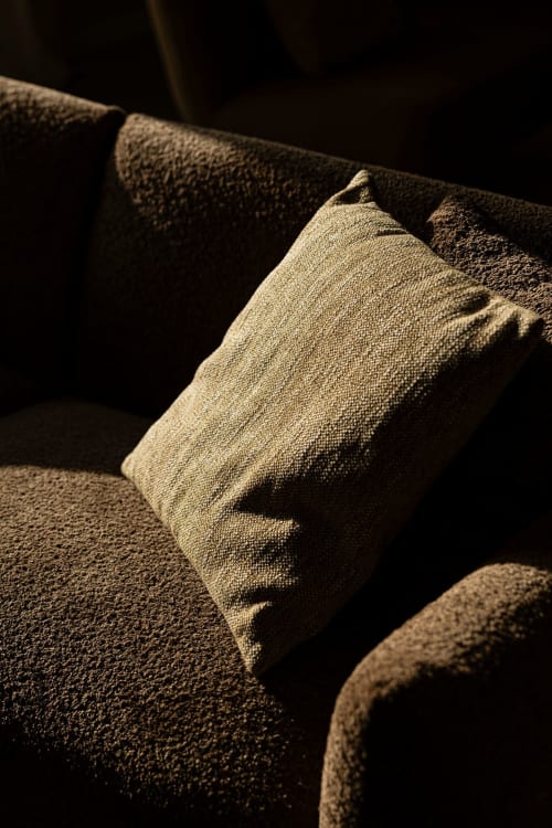 Neutral beige cushion on dark couch at Sea'Ya Casa Pavão villa in Colares, Portugal