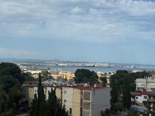 Balcony view of Salou city, Mediterranean Sea, and waterfront from a 2-bedroom apartment