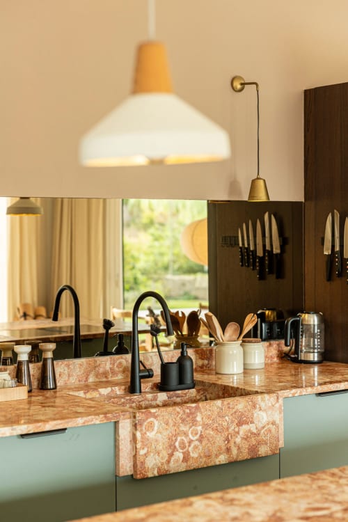 Modern kitchen at Sea'Ya Villas Cascais with terracotta apron sink, pendant lighting, and garden views