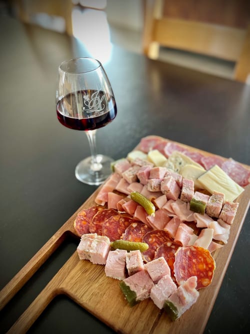Red wine and charcuterie board at Domaine Joseph Lafarge Wine Resort, Lugny France