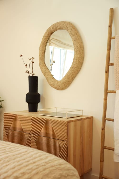 Modern bedroom dresser with cork mirror and black vase at Sea'Ya Villas, Cascais