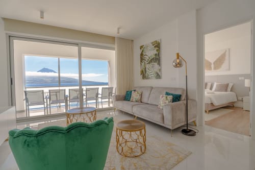 Luxury apartment living room at Suites Avenue Lux in Horta with ocean and mountain views