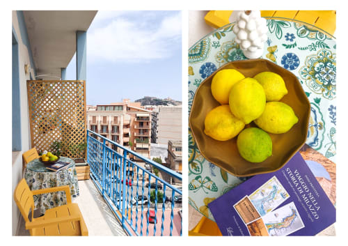 Appartamento in balconata siciliana a Milazzo con vista sulla città, limoni freschi e arredamento colorato
