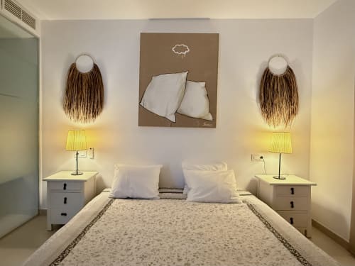 Modern bedroom at Villa Carlota in Villajoyosa with white pillows, pendant lamps, and minimalist decor