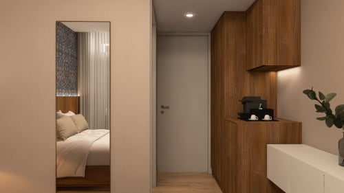 Modern bedroom at Feel Sintra B&B in Portugal featuring wood cabinetry, wall mirror, and contemporary furnishings
