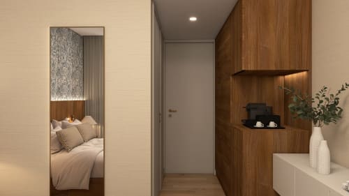 Entrada moderna da Feel Sintra B&B em Portugal, com parede de madeira com prateleiras e vista da cama através de vidro
