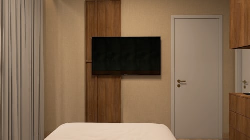 Quarto moderno no Feel Sintra com TV de parede, acabamentos em madeira e decoração em tons bege na suíte D. Maria I