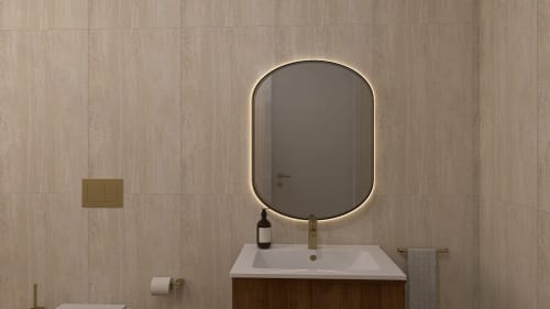 Banheiro moderno com espelho oval iluminado do boutique hotel Feel Sintra em Sintra, Portugal