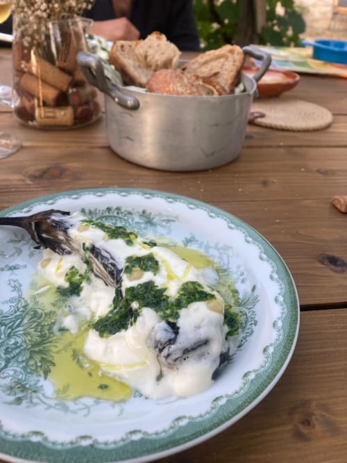Baked fish with creamy sauce and herbs at Agriturismo Colle Mura in Gualdo Tadino, Italy