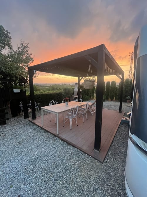 Modern outdoor dining pavilion at sunset in El Pla Del Penedès, Barcelona wine region