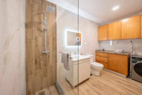 Modern bathroom and kitchenette in Michaels Garden apartment at Garry's Holiday Rentals, Calheta, with walk-in shower,