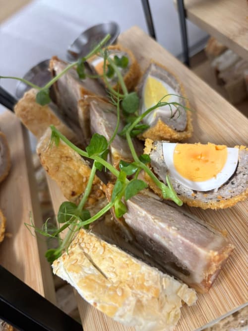 Gourmet open sandwiches with pâté, quail eggs and microgreens at The Old Kings Head, Kirton