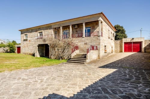 Stone villa in Chaves, Portugal with red doors, garden, terrace and balcony - 6-bedroom house rental