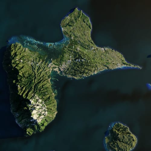 Aerial view of lush green islands surrounded by turquoise waters near Sainte-Anne, Guadeloupe