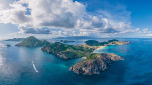 Aerial view of lush green islands with turquoise waters near Sainte-Anne, Guadeloupe