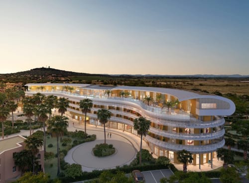 Complexe d'appartements de luxe aux lignes courbes Agde Infinity, façades illuminées, palmiers et vues panoramiques sur la campagne
