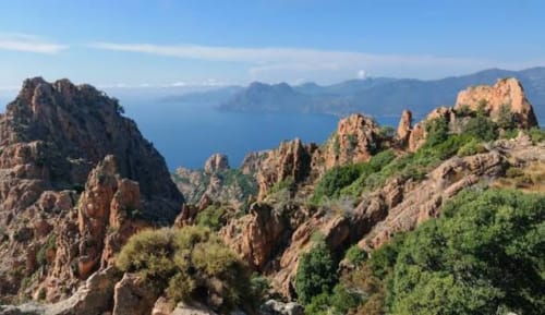 Dramatic red rock formations and Mediterranean sea view from Villa Abbracciu in Pietrosella, Corsica