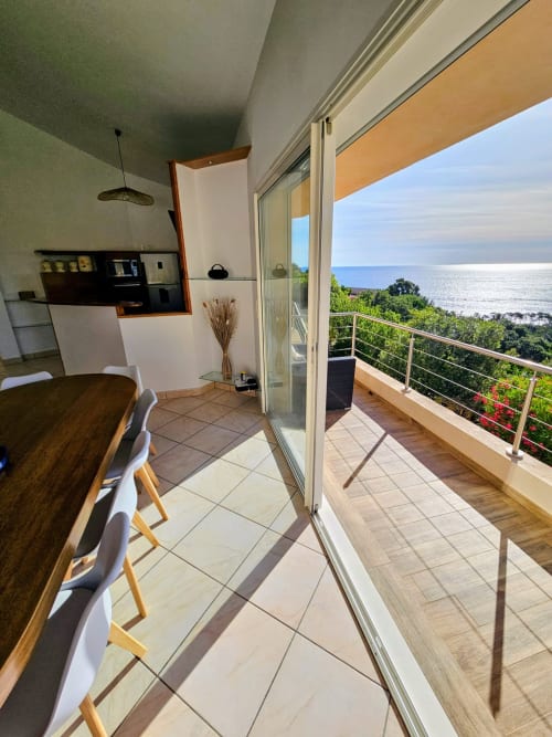 Villa Eva dining area with sea view terrace overlooking Mediterranean, Favone Corsica
