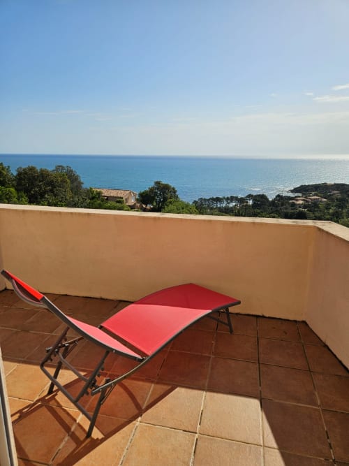 Red sun loungers on terrace at Villa Eva, Corsu Di Core, Favone with Mediterranean sea view