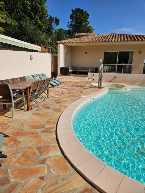 Villa Eva poolside at Corsu Di Core, Favone - heated pool with loungers, stone terrace, and beachfront villa.