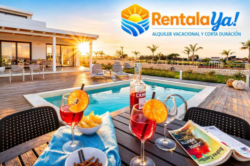 RentalaYa! vacation rental with pool, sunset view, cocktails and appetizers on deck in Spain
