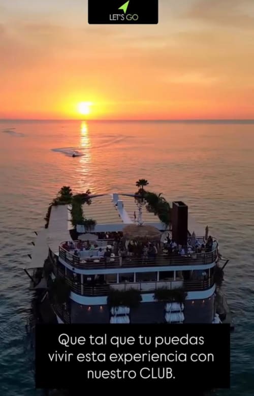 Luxury sunset cruise with decorated boat and guests celebrating at sea during golden hour