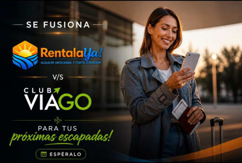 Woman checking phone with luggage for RentalaYa! vacation rentals partnership with Club Viago