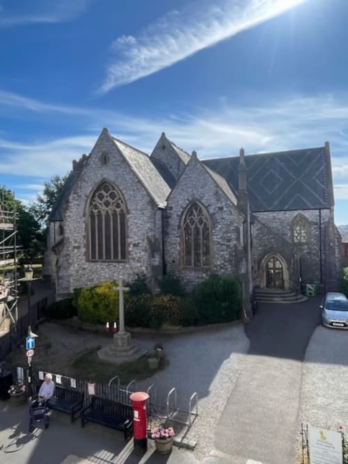 Historic stone Methodist chapel in Topsham, Exeter, with Gothic windows and pitched roof on Fore Street