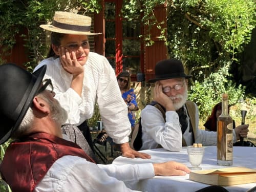 Guests enjoying wine and conversation at Domaine de l'Ocrerie, a charming bed and breakfast in Pourrain, France.