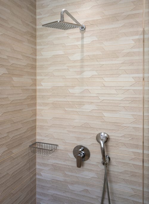 Modern shower with rainfall showerhead and sleek fixtures in Villa Freedom's Cretan bathroom