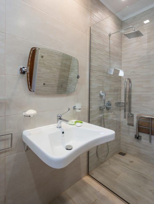 Modern bathroom at Villa Freedom with white sink, mirror, and walk-in shower, Kokkino Chorio, Crete