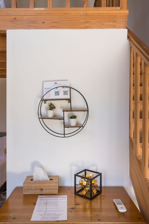 Stylish bedroom shelf display at Villa Freedom with succulents, decorative items, and welcome materials in Crete