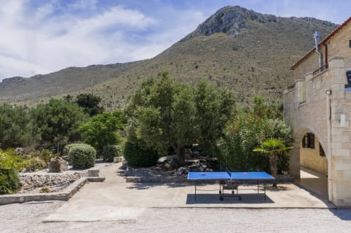 Villa Freedom courtyard with ping pong table, mountain views in Kokkino Chorio, Crete