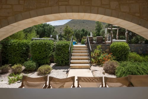 Villa Freedom terrace with lounge chairs overlooking gardens and Cretan mountains, Kokkino Chorio
