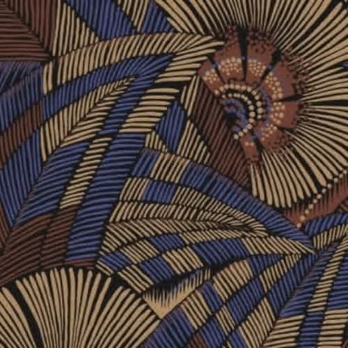 Tissu aux motifs géométriques inspirés de l'Afrique en bleu, or et terre cuite au Jardin de la Reyssouze