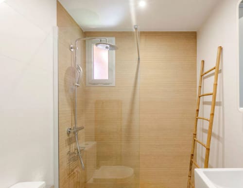 Modern shower enclosure with beige tile walls, rainfall showerhead, and bamboo towel ladder in SWEET GREEN 21 villa at Home