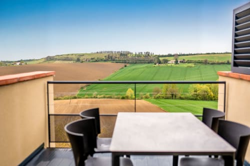 Studio terrace at Lieu-dit Boulage in Marquefave with panoramic views of rolling green fields and countryside