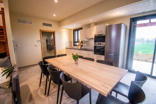Modern kitchen and dining area in Duplex Boulage apartment at Lieu-dit Boulage hotel, Marquefave, France