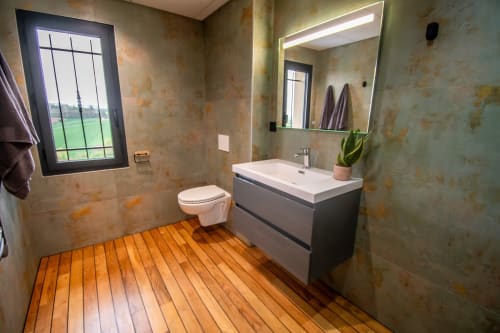 Modern bathroom in Duplex Boulage at Lieu-dit Boulage hotel, Marquefave, with wood floor, vanity sink, toilet, and