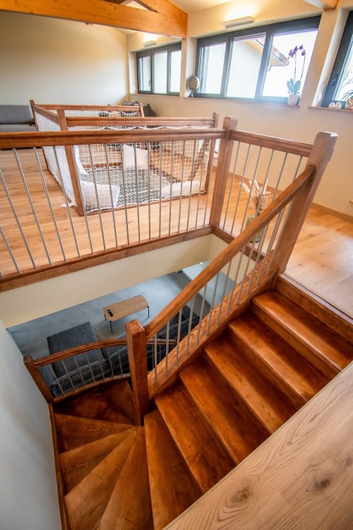 Modern wooden staircase with metal railings in Duplex Boulage apartment at Lieu-dit Boulage hotel, Marquefave, France