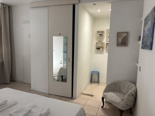 Modern Milan apartment studio with ensuite bathroom, compact design, contemporary furnishings and air conditioning