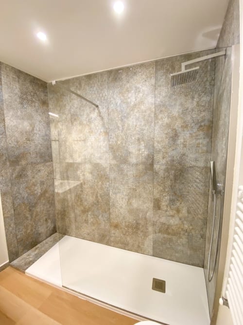 Modern walk-in shower with grey tiled walls and white base in San Marco Luxury Suites, Verona hotel room