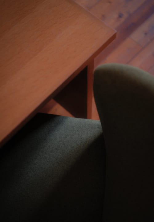 Moulin Renaudiots Rolin room detail with wooden furniture and upholstered chair, Autun hotel