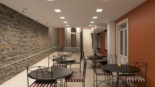 Modern lounge area at Feel Sintra with stone walls, black tables, and contemporary seating in Sintra, Portugal