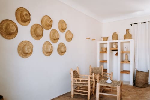 Boheme Supérieur room at Eucalyptus Ethnic hotel in Essaouira with woven basket wall art and rustic wooden furniture