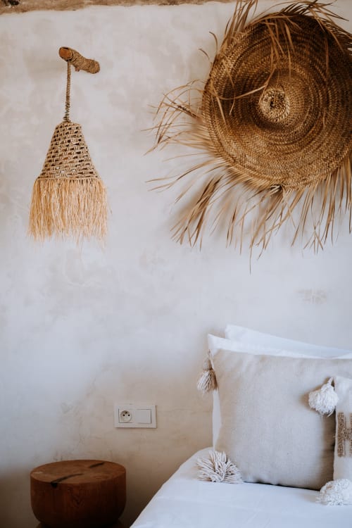 Boheme room detail at Eucalyptus Ethnic hotel, Essaouira with woven wall decor and cream textiles